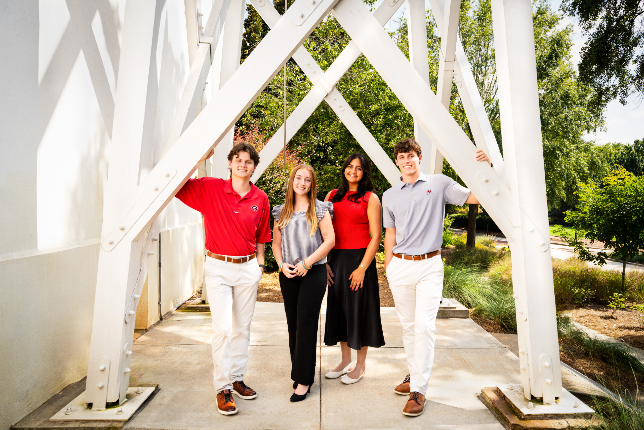 AnnualGiving-2025-EngagementCenter-StudentWorkers-1 Student workers under the iconic Chapel Bell