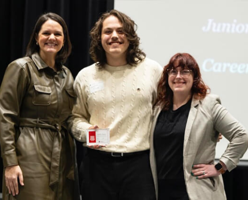 Griffin Dunn receiving his award with his supervisor and VP Jill Walton