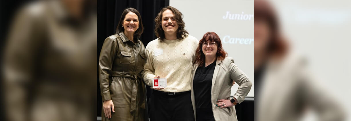 Griffin Dunn receiving his award with his supervisor and VP Jill Walton