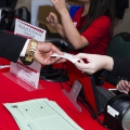 A student receives their name tag at the 2017 Fall Career Fair