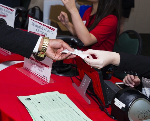 A student receives their name tag at the 2017 Fall Career Fair