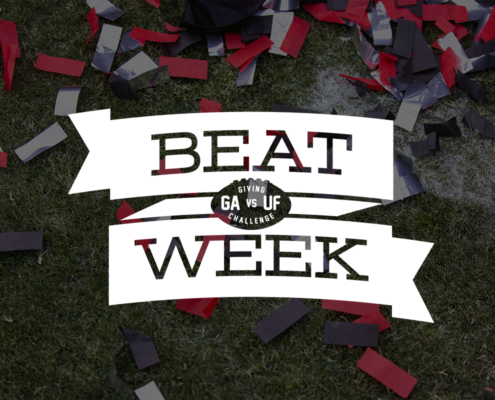 photo of confetti on football field with Beat Week logo on top