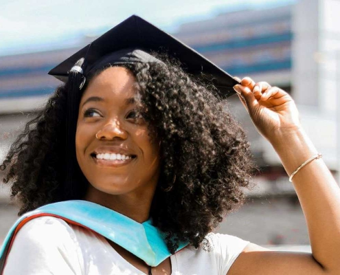 Photo of Author Krislyn Johnson in Graduation Cap