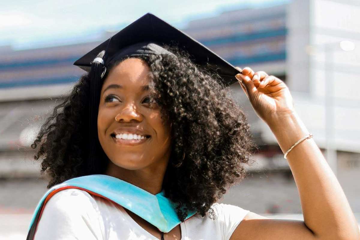 Photo of Author Krislyn Johnson in Graduation Cap