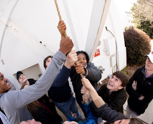 Prospective students ring the Chapel Bell while touring campus